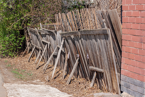 Old rickety wooden fence with props.