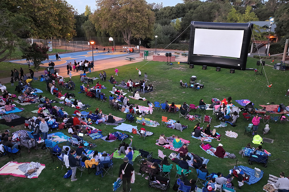 PCTV DRONE IMAAGE OF MOVIE IN THE PARK CROWD JUST BEFORE SUNSET