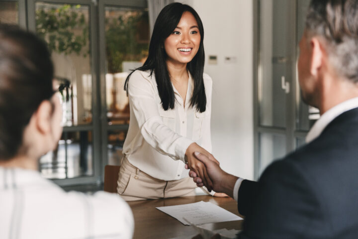 Image of two people shaking hands.